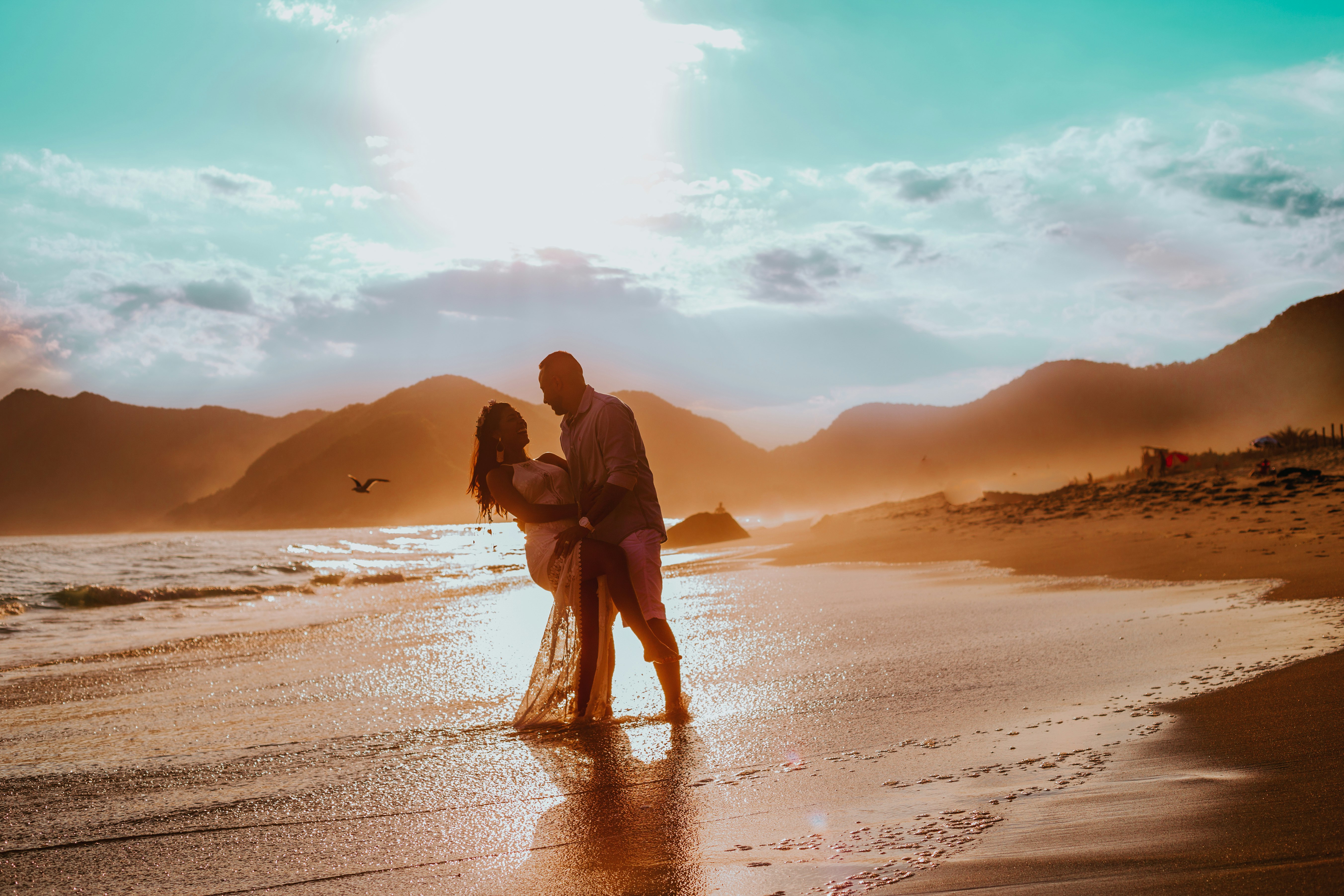 couple walking in seashore